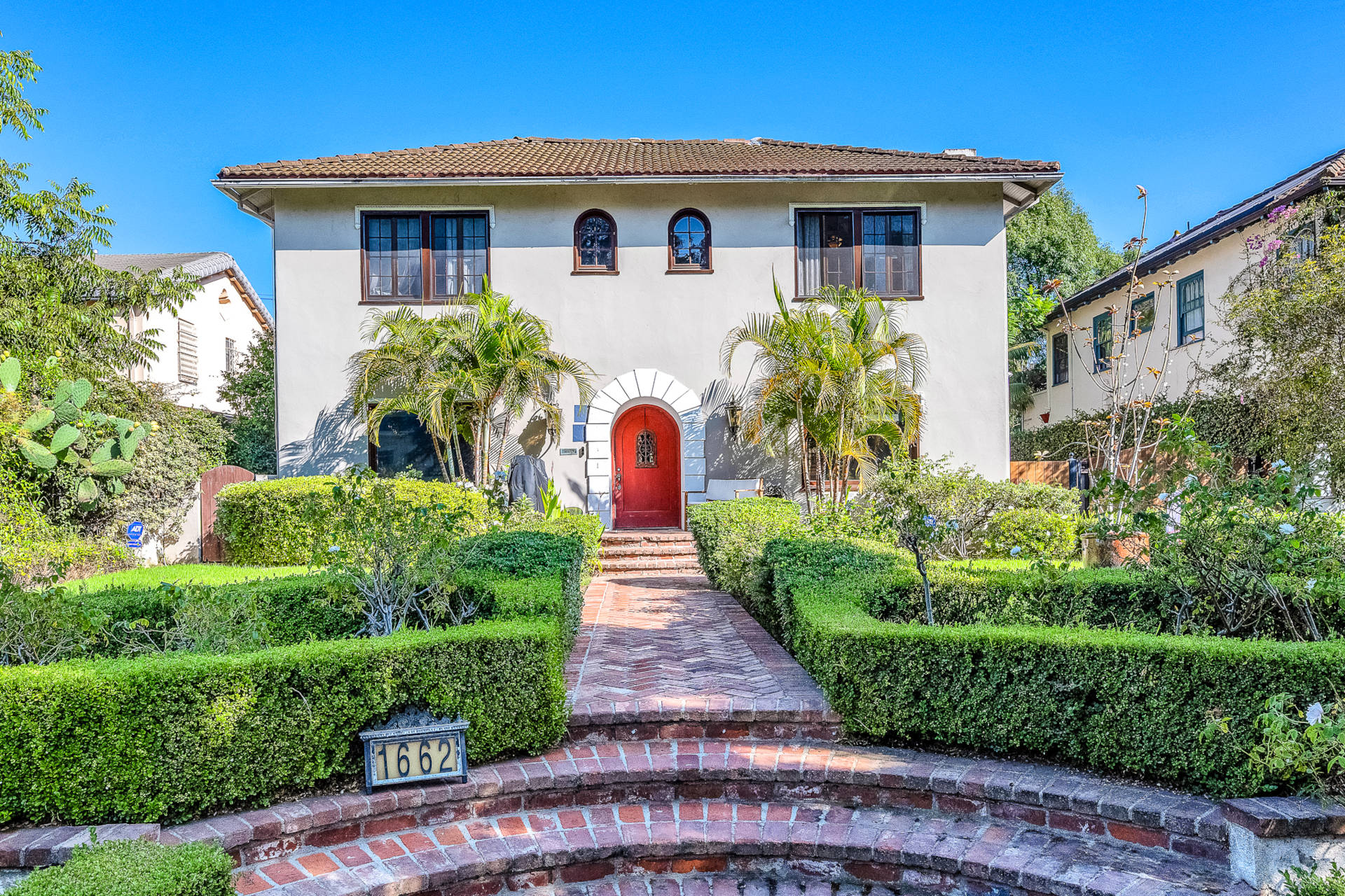 Exterior photo of a Spanish colonial home in LA available as a short term rental